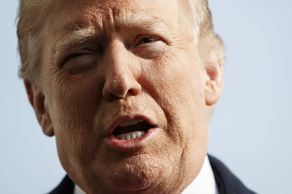 
              President Donald Trump talks to media before boarding Marine One on the South Lawn of the White House in Washington, Saturday, Dec. 8, 2018, for the short trip to Andrews Air Force Base en route to Philadelphia to attend the Army-Navy Football Game. (AP Photo/Carolyn Kaster)
            