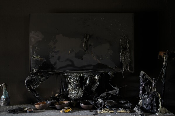 A melted television is seen inside a destroyed house in kibbutz Kfar Azza, Israel, near the Gaza Strip, Tuesday, Nov. 7, 2023. The kibbutz was attacked on Oct. 7 by Hamas militants, who killed and kidnapped members of its community. (AP Photo/Bernat Armangue)