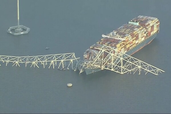 Parts of the Francis Scott Key Bridge remain after a container ship collided with one of the bridge’s support Tuesday, March 26, 2024 in Baltimore. The major bridge in Baltimore snapped and collapsed after a container ship rammed into it early Tuesday, and several vehicles fell into the river below. Rescuers were searching for multiple people in the water. (WJLA via AP)