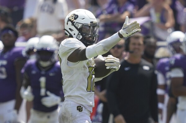 Colorado cornerback Travis Hunter motions after a catch for a first down against TCU during the first half of an NCAA college football game, Saturday, Sept. 2, 2023, in Fort Worth, Texas. (AP Photo/LM Otero)