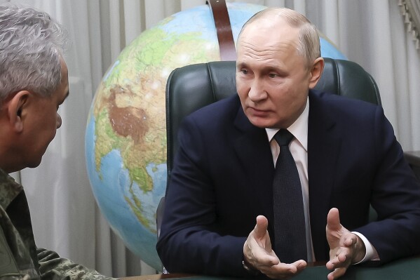 Russian President Vladimir Putin, right, gestures while speaking to Russian Defense Minister Sergei Shoigu at the headquarters of Russia's Southern Military District in Rostov-on-Don, Russia, on Thursday, Nov. 9, 2023. (Gavriil Grigorov, Sputnik, Kremlin Pool Photo via AP)