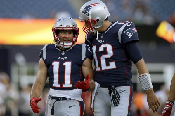 
              FILE - In this Aug. 9, 2018, file photo, New England Patriots wide receiver Julian Edelman (11) talks with quarterback Tom Brady (12) before a preseason NFL football game against the Washington Redskins in Foxborough, Mass. There’s just two receivers in NFL postseason history with over 100 catches – Jerry Rice with 151 and Edelman with 105. That link has only been strengthened off the field in the past year as Brady and Edelman prepare to play in their fourth Super Bowl together. (AP Photo/Charles Krupa, File)
            