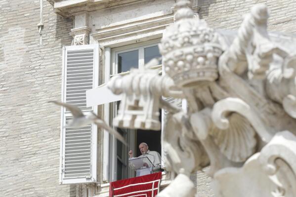 Pope Francis delivers his blessing as he recites the Regina Caeli noon prayer from the window of his studio overlooking St.Peter's Square, at the Vatican, Sunday, April 18, 2021. Pope Francis said he is happy to be back greeting the faithful in St. Peter’s Square faithful for his traditional Sunday noon blessing after weeks of lockdown measures.  (AP Photo/Andrew Medichini)