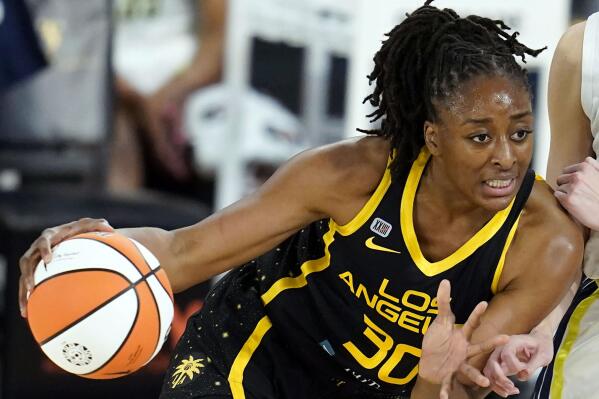 FILE - Los Angeles Sparks forward Nneka Ogwumike drives against the Dallas Wings during the first half of a WNBA basketball game in Los Angeles, May 14, 2021. Ogwumike will serve a third term as president of the WNBA Players Association after being re-elected. (AP Photo/Ashley Landis, File)