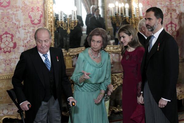 FILE - From left to right: Spain's former King Juan Carlos, Spain's former Queen Sofia, Spain's Queen Letizia, and Spain's King Felipe VI at the Royal Palace in Madrid, Wednesday Jan. 23, 2013. The Spanish government is set to pass a decree Tuesday aimed at boosting transparency in a monarchy still reeling from scandals involving King Felipe VI's father, Juan Carlos. The move comes a day after Felipe made public his personal assets of €2.6 million euros ($2.8 million) for the first time ever. (AP Photo/Juan Carlos Rojas, File)