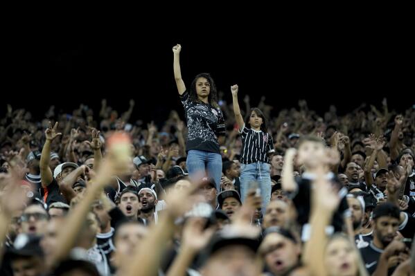 Fans from Brazil's Corinthians cheer their team prior to a Copa Libertadores soccer match against Argentina's Boca Juniors in Sao Paulo, Brazil, Tuesday, April 26, 2022. (AP Photo/Andre Penner)