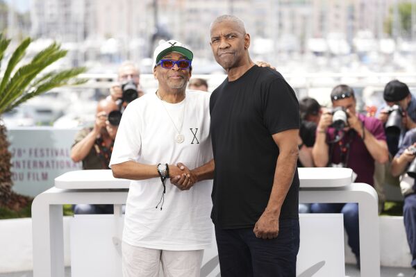 Director Spike Lee, left, and Denzel Washington pose for photographers at the photo call for the film 'Highest 2 Lowest' at the 78th international film festival, Cannes, southern France, Monday, May 19, 2025. (Photo by Scott A Garfitt/Invision/AP)
