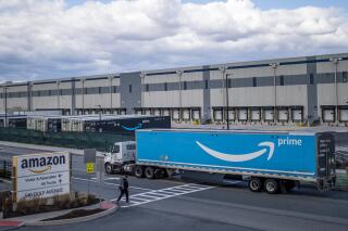 FILE - A truck arrives at the Amazon warehouse facility on the Staten Island borough of New York, April 1, 2022. Amazon is planning to sublease some of its warehouse space because the pandemic-fueled surge in online shopping has slowed. (AP Photo/Eduardo Munoz Alvarez, File)