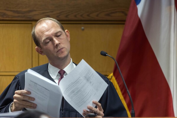 Fulton County Superior Judge Scott McAfee looks through paperwork during a jury questionnaire hearing in his courtroom at the Fulton County Courthouse on Monday, Oct. 16, 2023, in Atlanta. (Alyssa Pointer/Pool Photo via AP)
