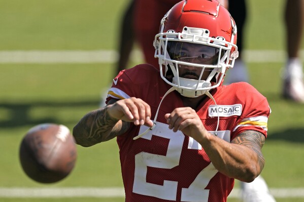 FILE - Kansas City Chiefs wide receiver Nikko Remigio catches a ball after NFL football training camp July 28, 2023, in St. Joseph, Mo. Historically, Asian Americans and have been stereotyped as more brains than brawn or "foreigners" not fit for some American sports. Many current and former athletes of Asian American as well as Pacific Islander heritage agreed that such misconceptions have mostly faded. Increasingly, major athletes have been able to amplify their culture on a public stage and be embraced by the public. (AP Photo/Charlie Riede, File)