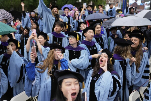Alumni will cheer on Columbia University's opening ceremony on Wednesday, May 21, 2025 in New York at Columbia's main campus in Manhattan. (AP Photo/Seth Wenig, pool)