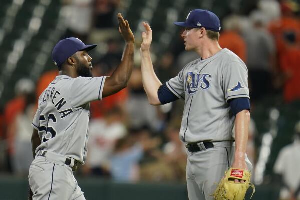 Tampa Bay Rays left fielder Randy Arozarena, left, and relief pitcher Pete Fairbanks celebrate after defeating the Baltimore Orioles 6-4 in ten innings of a baseball game, Wednesday, July 27, 2022, in Baltimore. (AP Photo/Julio Cortez)