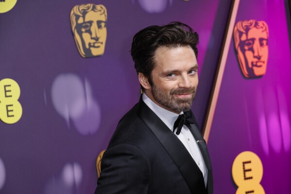 Sebastian Stan poses for photographers upon arrival at the 78th British Academy Film Awards, BAFTA's, in London, Sunday, Feb. 16, 2025. (Photo by Joel C Ryan/Invision/AP)