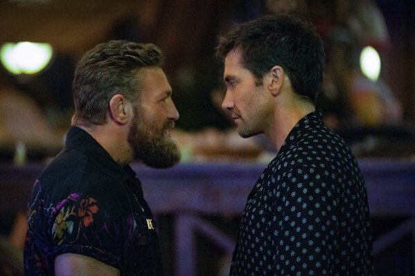 This image released by Prime Video shows Conor McGregor, left, and Jake Gyllenhaal in a scene from "Road House." (Laura Radford/Prime Video via AP)