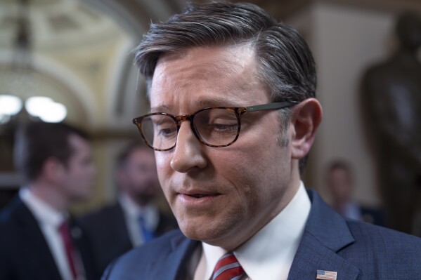 Speaker of the House Mike Johnson, R-La., talks to reporters just after lawmakers pushed a $95 billion national security aid package for Ukraine, Israel and other U.S. allies closer to passage, at the Capitol in Washington, Friday, April 19, 2024. (AP Photo/J. Scott Applewhite)