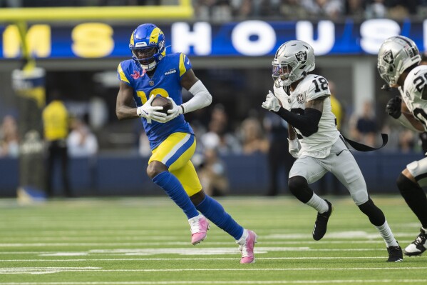 Los Angeles Rams wide receiver Tyler Johnson (18) runs with the ball past Las Vegas Raiders cornerback Jack Jones (18) during an NFL football game, Sunday, Oct. 20, 2024, in Inglewood, Calif. (AP Photo/Kyusung Gong, File)