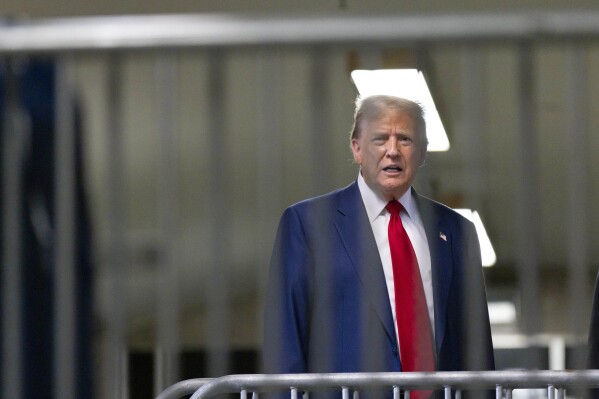 Former President Donald Trump talks to reporters as leaves the courtroom following the day's proceedings in his trial at Manhattan criminal court in New York, Tuesday, April 30, 2024. (Justin Lane/Pool Photo via AP)