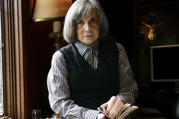 FILE - Author Anne Rice poses for a photo at her home Oct. 26, 2005, in San Diego. Rice’s “Interview with the Vampire” is rising again on screen, this time for TV. The bestselling novel, which was adapted for the 1994 Brad Pitt-Tom Cruise film, will be the basis for a new AMC and AMC+ series set for 2022. (AP Photo/Lenny Ignelzi, File)