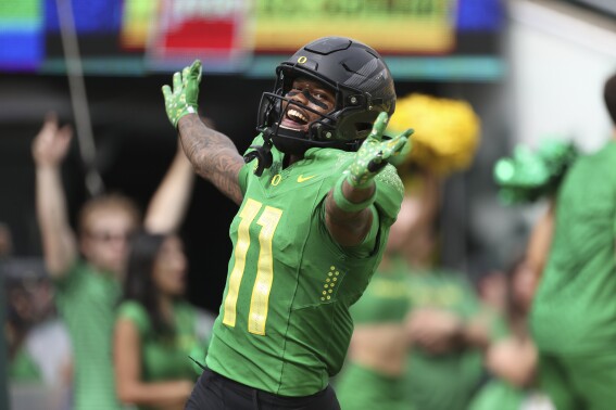 Oregon wide receiver Troy Franklin celebrates after scoring a touchdown against Colorado during the first half of an NCAA college football game, Saturday, Sept. 23, 2023, in Eugene, Ore. (AP Photo/Amanda Loman)