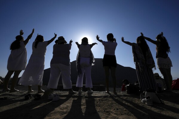 Worshippers dressed in white gather before the Pyramid of the Sun as part of the Spring Equinox celebrations, in Teotihuacan, Mexico, March 21, 2024. Each year the Pyramid of the Sun and the adjacent Pyramid of the Moon draw thousands of pilgrims to the pre-Hispanic ceremonial and trading centre, northeast of Mexico City. (AP Photo/Fernando Llano)