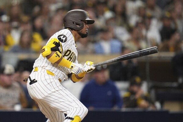 San Diego Padres' Luis Arraez watches his RBI single during the fifth inning of a baseball game against the Miami Marlins Tuesday, May 27, 2025, in San Diego. (AP Photo/Gregory Bull)