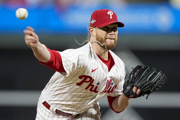 FILE -Philadelphia Phillies relief pitcher Craig Kimbrel throws against the Arizona Diamondbacks during the eighth inning in Game 6 of the baseball NL Championship Series in Philadelphia, Monday, Oct. 23, 2023. The Baltimore Orioles have added reliever Craig Kimbrel on a one-year deal for $13 million, adding the nine-time All-Star to their bullpen. The deal agreed to Wednesday, Dec. 6, 2023 on the final day of the winter meetings. (AP Photo/Brynn Anderson, File)