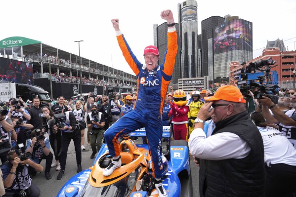 Scott Dixon celebrates winning the IndyCar Detroit Grand Prix auto race in Detroit, Sunday, June 2, 2024. (AP Photo/Paul Sancya)