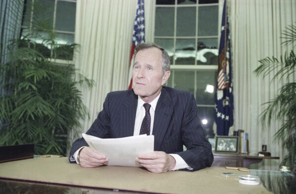 FILE - President George H.W. Bush addresses the nation on May 1, 1992, from the Oval Office in Washington. George H.W. Bush was the last president to use the Insurrection Act, a response to riots in Los Angeles in 1992 after the acquittal of the white police officers who beat Black motorist Rodney King in an incident that was videotaped. (AP Photo/Dennis Cook, File)