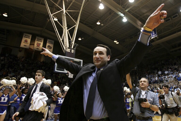 FILE - Duke coach Mike Krzyzewski celebrates after the No. 7 Blue Devils beat No. 7 North Carolina 71-70 at Cameron Indoor Stadium in Durham, N.C., on Wednesday, Feb. 9, 2005.  (AP Photo/Gerry Broome, File)