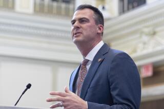 FILE - Oklahoma Gov. Kevin Stitt delivers his State of the State address in Oklahoma City, on Monday, Feb. 7, 2022. Stitt has signed a bill prohibiting the use of nonbinary gender markers on state birth certificates. The first-term Republican signed the bill Tuesday, April 26, 2022.  (AP Photo/Alonzo Adams, File)