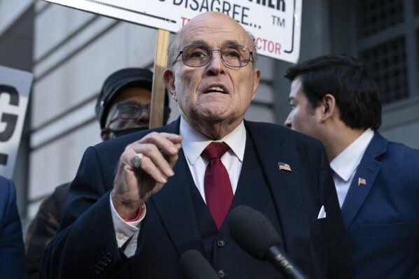 FILE - Former Mayor of New York Rudy Giuliani speaks during a news conference outside the federal courthouse in Washington, Friday, Dec. 15, 2023. A jury awarded $148 million in damages on Friday to two former Georgia election workers who sued Giuliani for defamation over lies he spread about them in 2020 that upended their lives with racist threats and harassment. (AP Photo/Jose Luis Magana, File)