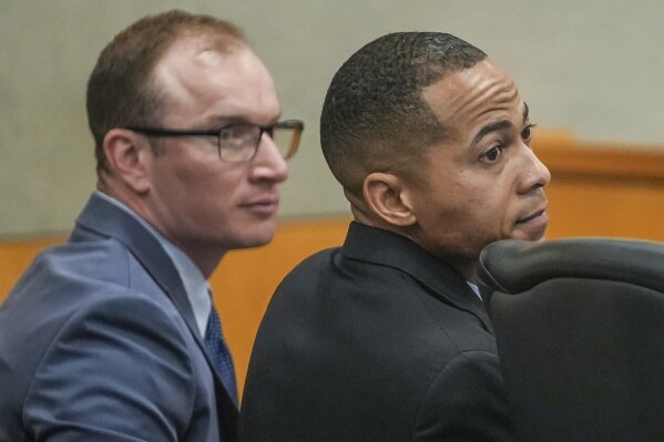 FILE - Former Williamson County Sheriff's deputies Zachary Camden, left, and J.J. Johnson look on during their manslaughter trial, Monday, Feb. 26, 2024, in Austin, Texas. The former deputies have been found not guilty in the death of a Black motorist who was shot several times with a stun gun following a police chase. A Travis County jury on Thursday, March 7, found Camden and Johnson not guilty on manslaughter charges in the 2019 death of 40-year-old Javier Ambler II. (Ricardo B. Brazziell/Austin American-Statesman via AP)