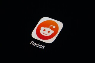 FILE - The Reddit app icon is seen on a smartphone on Feb. 28, 2023, in Marple Township, Pa. More than 8,000 subreddits, or Reddit communities, have gone dark as of Tuesday, June 13, in protest of upcoming API changes, which include a controversial policy that will charge some third-party apps for continued use. (AP Photo/Matt Slocum, File)
