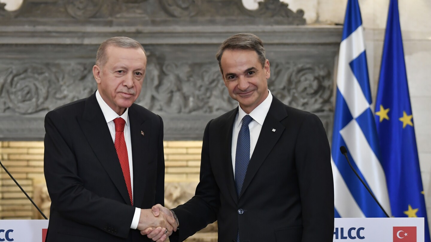 Turkish and Greek leaders turn on the charm in Athens as they vow to leave years of animosity behind