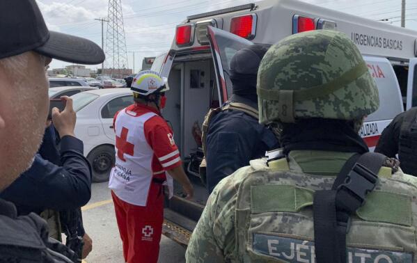 A Red Cross worker closes the door of an ambulance carrying two Americans found alive after their abduction in Mexico last week, in Matamoros, Tuesday, March 7, 2023. Two of four Americans whose abduction in Mexico was captured in a video that showed them caught in a cartel shootout have been found dead, officials said Tuesday. The two surviving Americans were taken to the border near Brownsville, Texas, in a convoy of Mexican ambulances and SUVs. (AP Photo)