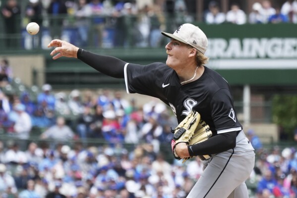 Chicago White Sox starting pitcher Jonathan Cannon throws against the Chicago Cubs during the first inning of a baseball game in Chicago, Sunday, May 18, 2025. (AP Photo/Nam Y. Huh)