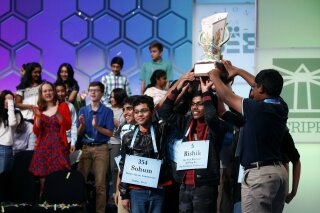 FILE - In this May 31, 2019 file photos, eight co-champions celebrate after winning the Scripps National Spelling Bee, in Oxon Hill, Md. The Scripps National Spelling Bee has been canceled after organizers concluded there was “no clear path to safely set a new date in 2020” because of the coronavirus pandemic.  (AP Photo/Patrick Semansky)