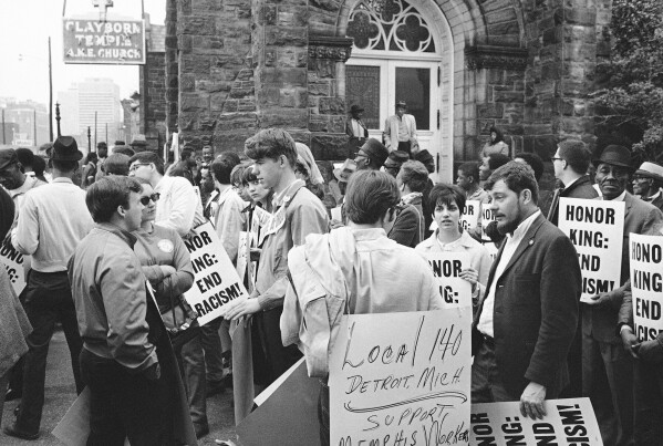 In this April 8, 1968, file photo, people gather at the Clayborn Temple as they prepare to march in honor of Dr. Martin Luther King in Memphis, Tenn., four days after the civil rights leader was assassinated. (AP Photo/File)