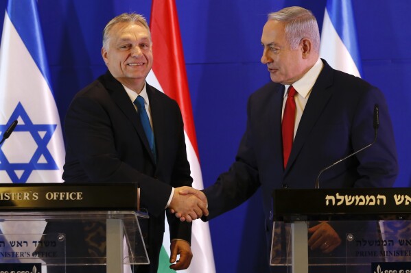 FILE - Hungarian Prime Minister Viktor Orban, left, and Israeli Prime Minister Benjamin Netanyahu attend a press conference after their meeting in Jerusalem, Tuesday, Feb. 19, 2019. Even before last month’s Hamas attacks in Israel, the leader of Hungary had long promoted his country as the safest in Europe for Jews. Now the Israeli men’s soccer team is taking his word and heading to a tiny Hungarian village as it prepares to play its remaining home games in the Euro 2024 qualifying tournament. Israel will host “home” games against Switzerland next Wednesday, Nov. 15, 2023. and Romania three days later. (AP Photo/Ariel Schalit, Pool, File)