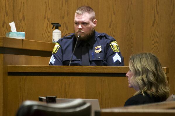 Euclid, Ohio police Sgt. Matthew Rhodes testifies Tuesday, Oct. 25, 2022, in the civil trial over his shooting and killing of Luke Stewart in March 2017. Rhodes, who fatally shot Stewart a Black driver during a struggle inside a car in 2017, must pay his family $4.4 million, a jury awarded Tuesday, Nov. 1, 2022. (Cory Shaffer/Cleveland.com via AP)