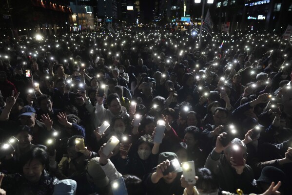 Supporters of South Korea's ruling People Power Party flash their smartphones' lights during the party's parliamentary election campaign in Seoul, South Korea, April 9, 2024. Voters handed liberals extended opposition control of parliament in what looks like a massive political setback to conservative President Yoon Suk Yeol. (AP Photo/Lee Jin-man)