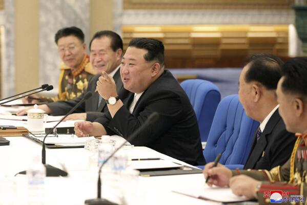 CORRECTS DATE - This photo provided by the North Korean government shows North Korean leader Kim Jong Un, center, attends a meeting with his senior military officials at undisclosed location, North Korea, Tuesday, June 21, 2022. Independent journalists were not given access to cover the event depicted in this image distributed by the North Korean government. The content of this image is as provided and cannot be independently verified. Korean language watermark on image as provided by source reads: "KCNA" which is the abbreviation for Korean Central News Agency. (Korean Central News Agency/Korea News Service via AP)