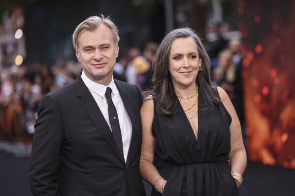 FILE - Director Christopher Nolan, left, and his wife, producer Emma Thomas, appear at the premiere for "Oppenheimer" on July 13, 2023 in London. (Vianney Le Caer/Invision/AP, File)