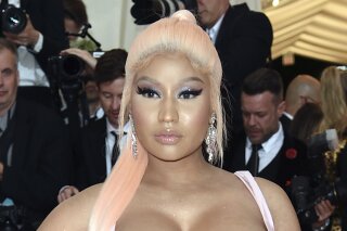FILE - In this Monday, May 6, 2019, file photo, Nicki Minaj attends The Metropolitan Museum of Art's Costume Institute benefit gala in New York. Minaj’s mother has filed a $150 million lawsuit against the man who is accused of killing the rapper's father in a hit-and-run crash in February 2021. (Photo by Evan Agostini/Invision/AP, File)