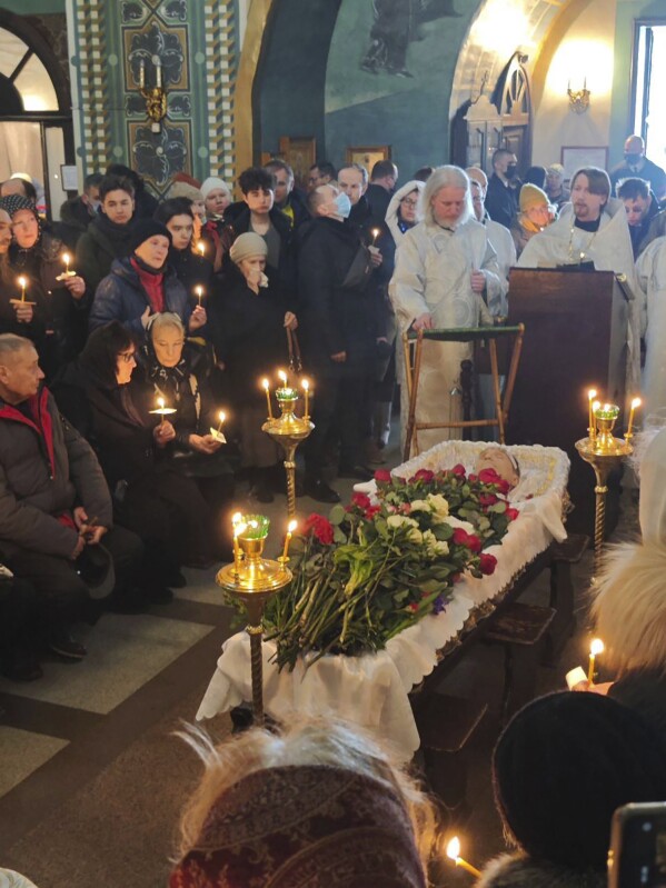 In this photo released by Navalny Team, relatives and friends pay their last respects at the coffin of Russian opposition leader Alexei Navalny in the Church of the Icon of the Mother of God Soothe My Sorrows, in Moscow, Russia, Friday, March 1, 2024. (Navalny Team via AP)