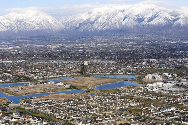 FILE - Homes in suburban Salt Lake City are shown, April 13, 2019. According to a new study released Monday, July 25, 2022, by the U.S. Census Bureau, by age 26 more than two-thirds of millennials lived in the same general area where they grew up, 80% had moved less than 100 miles away and 90% resided less than 500 miles away. (AP Photo/Rick Bowmer, File)