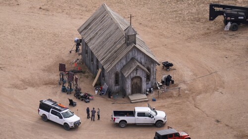 FILE - This aerial photo shows the movie set of "Rust," at Bonanza Creek Ranch, Oct. 23, 2021, in Santa Fe, N.M. Prosecutors are accusing the weapons supervisor on the film set where Alec Baldwin shot and killed a cinematographer of drinking and smoking marijuana in the evenings during the filming of “Rust,” saying she was likely hung over when she loaded a live bullet into the revolver that was used by the actor. (AP Photo/Jae C. Hong, File)