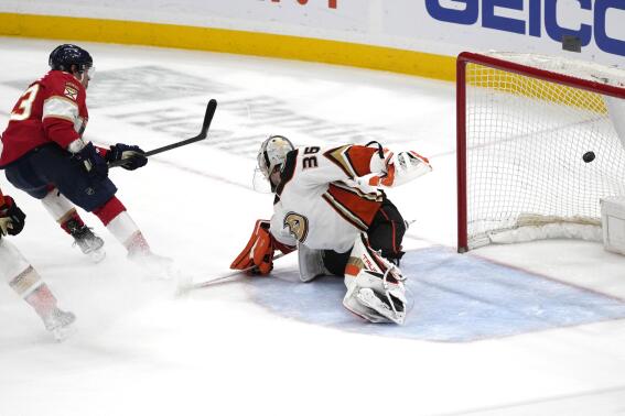Florida Panthers center Carter Verhaeghe (23) scores the winning goal against San Jose Sharks goaltender Kaapo Kahkonen (36) during overtime of a NHL game, Monday, Feb. 20, 2023, in Sunrise, Fla. The Panthers defeated the Sharks 4-3. (AP Photo/Marta Lavandier)
