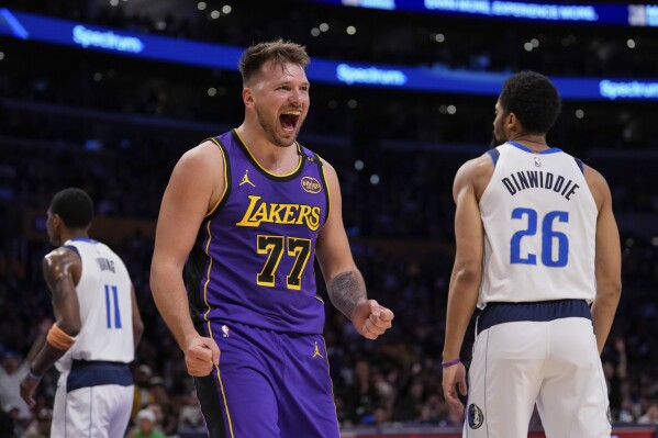 Luka Doncic posts a triple-double against the Dallas Mavericks, leads the  Lakers to a 107-99 win | AP News