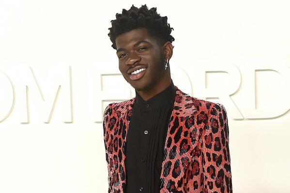 FILE - Lil Nas X attends the Tom Ford show at Milk Studios during NYFW Fall/Winter 2020 on Feb. 7, 2020, in Los Angeles. The rapper has been awarded the inaugural Suicide Prevention Advocate of the Year Award from the advocacy group The Trevor Project. The Trevor Project is a nonprofit dedicated to suicide prevention and crisis intervention for lesbian, gay, bisexual, transgender, queer and questioning young people. (Photo by Jordan Strauss/Invision/AP, File)